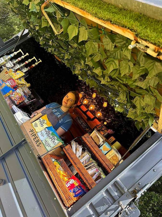 Wicker baskets of crisps, cookies and snacks on the counter of the coffee van